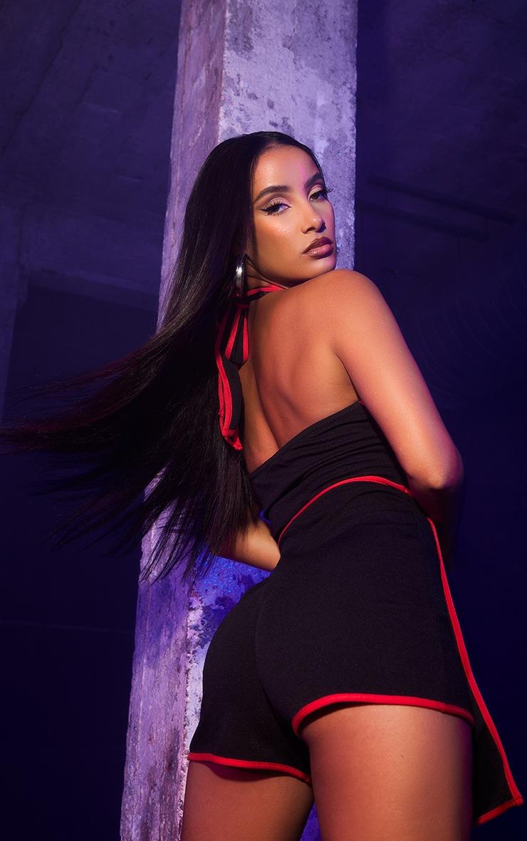Pretty Little Thing Black Halterneck Red Binding Ninja Romper