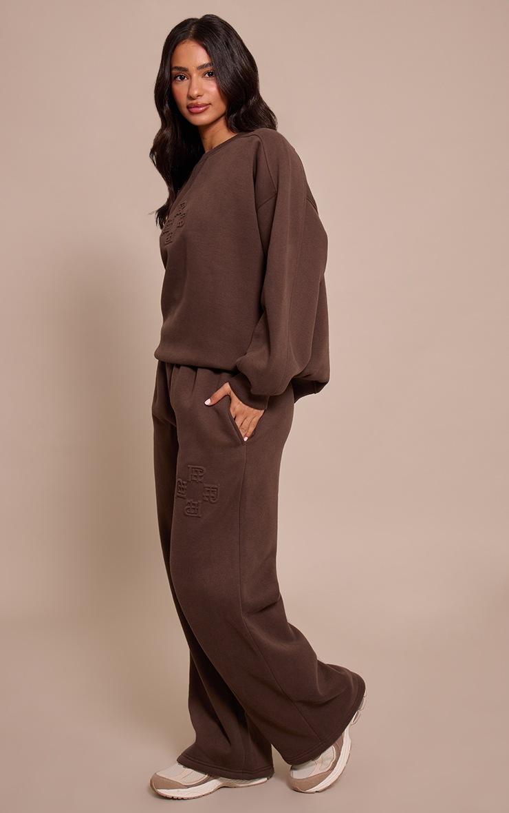 Pretty Little Thing Petite Chocolate PLT Embossed Crew Neck Sweatshirt