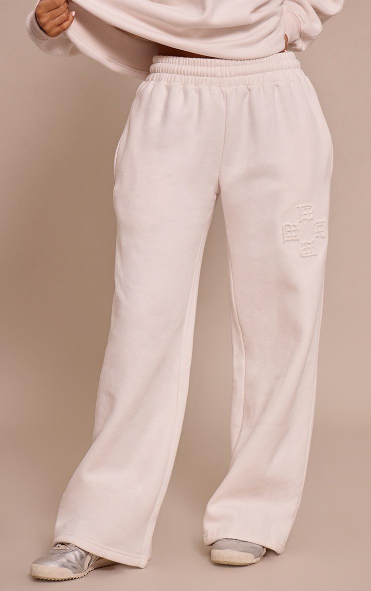 Pretty Little Thing Petite Cream PLT Embossed Wide Leg Sweatpants