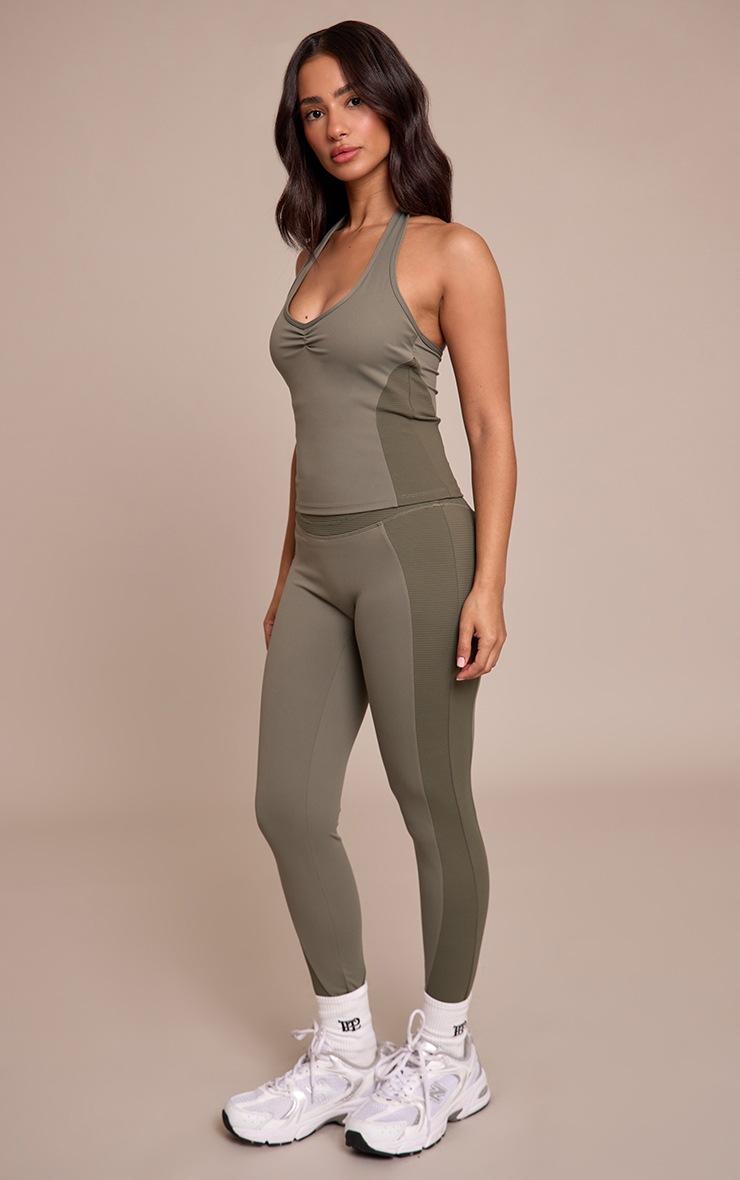 Pretty Little Thing Petite Olive Sculpt Rib Panel Halterneck Gym Top