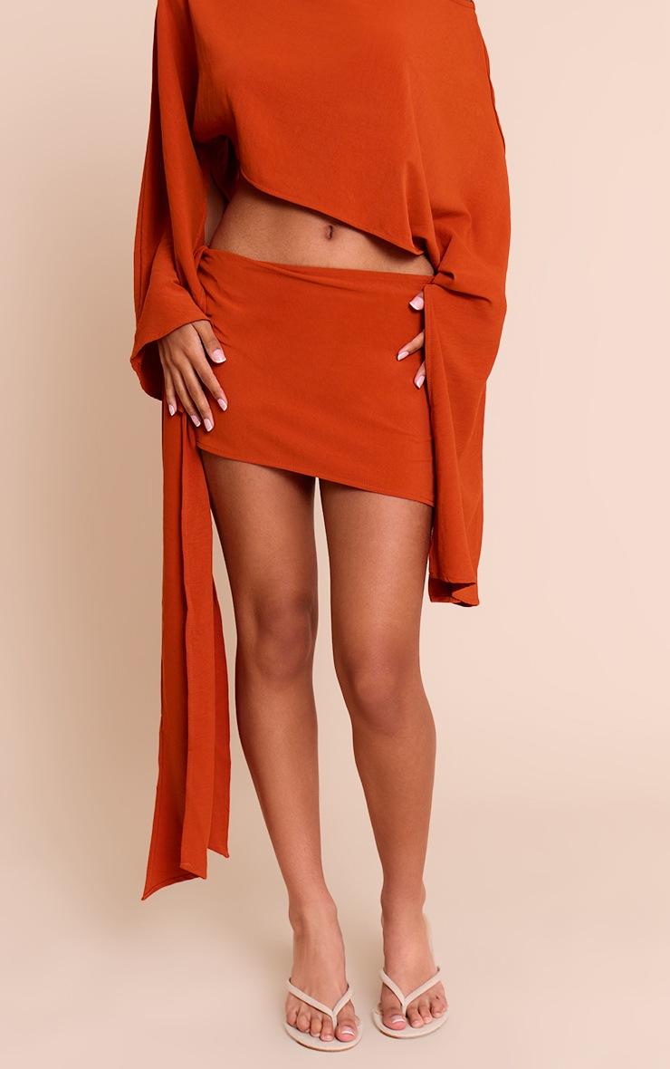 Pretty Little Thing Petite Rust Floaty Knot Side Mini Skirt