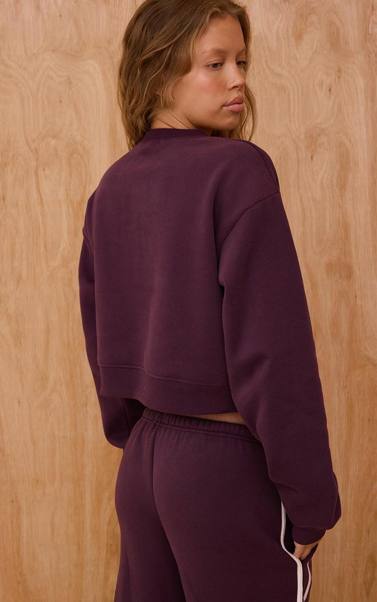 Pretty Little Thing Plum Sports Club Print Cropped Sweatshirt