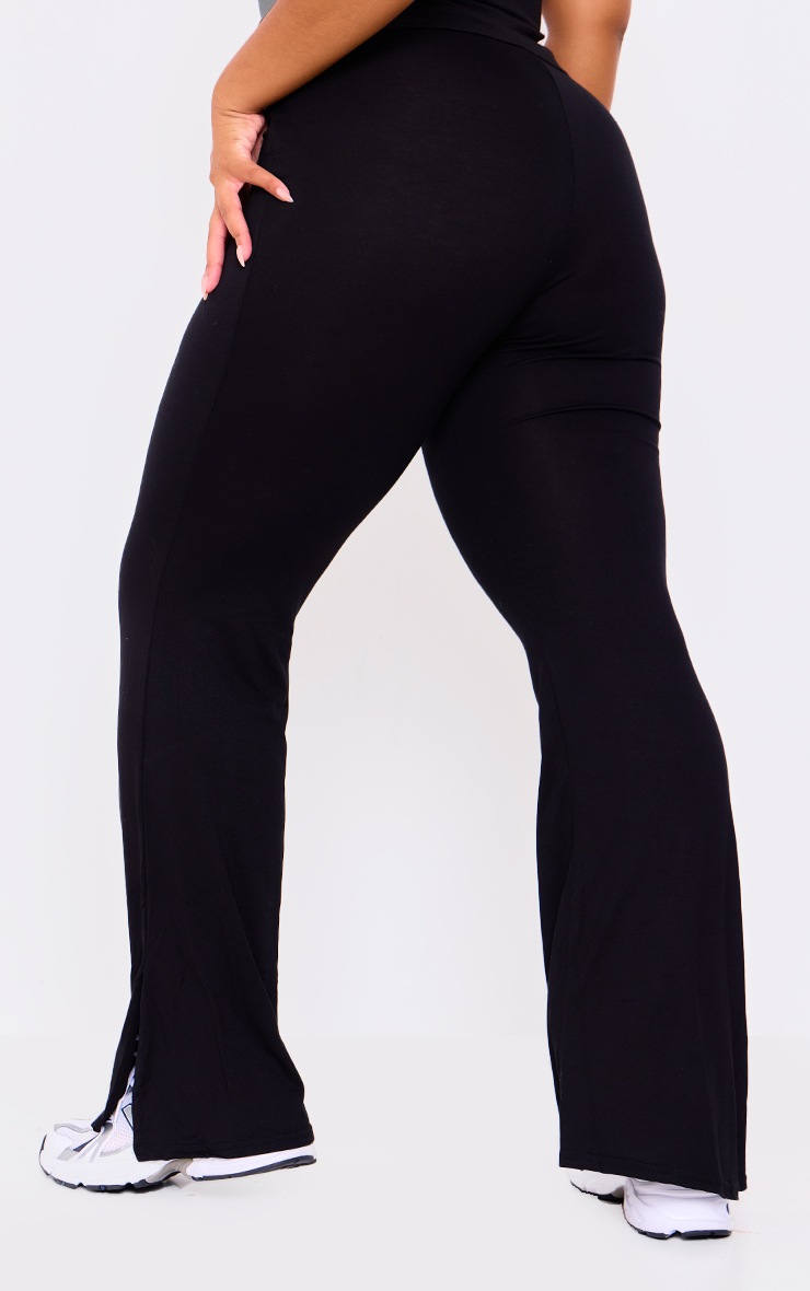 Pretty Little Thing Plus Black Jersey Split Hem Flared Trousers