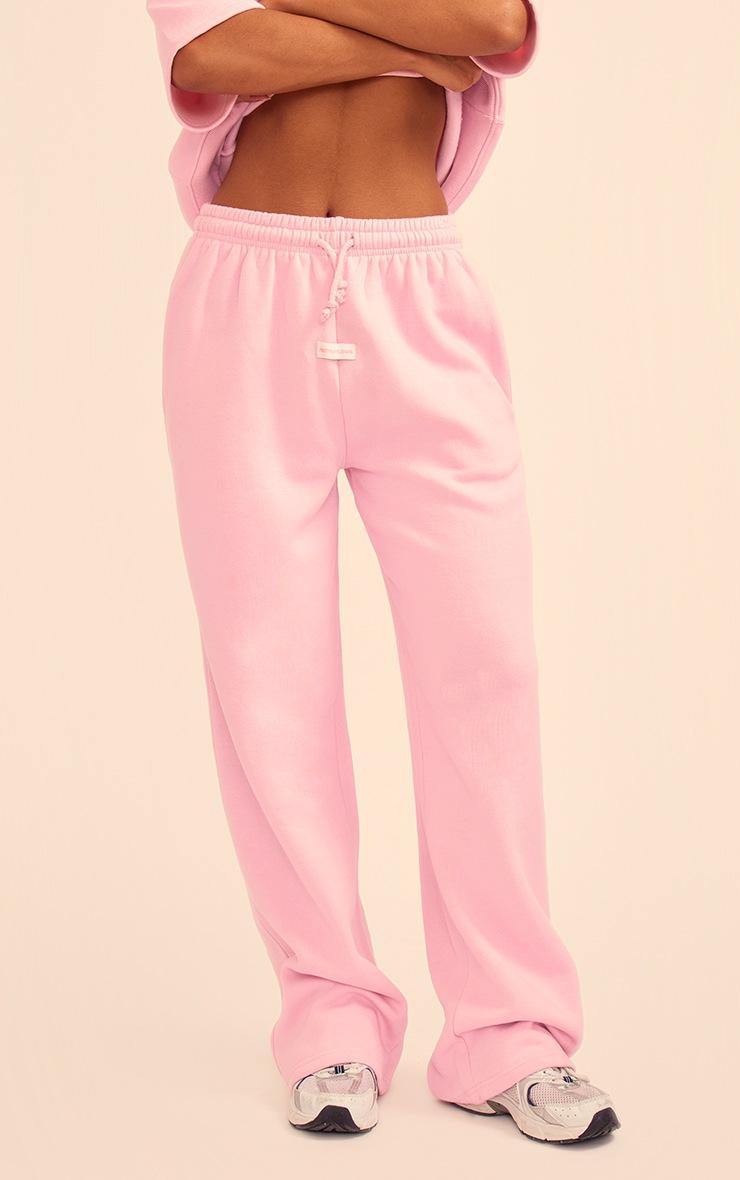 Pretty Little Thing PRETTYLITTLETHING Baby Pink Badge Detail Mid Rise Wide Leg Sweatpants