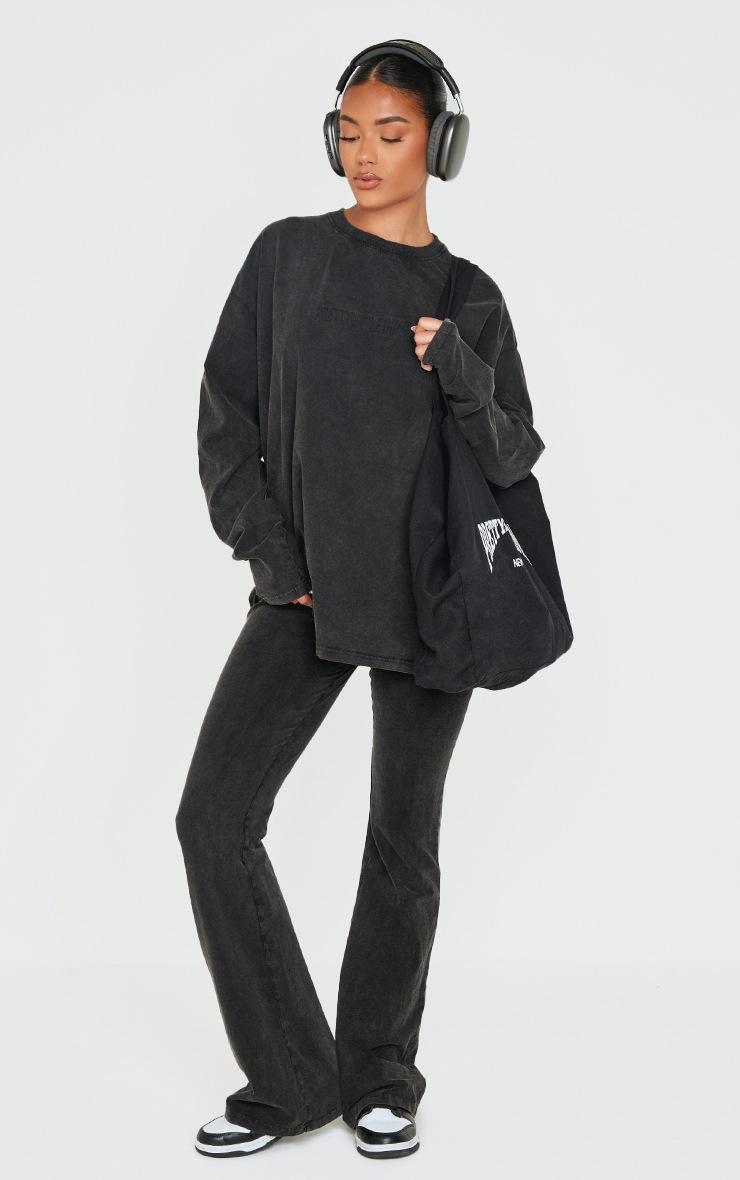 Pretty Little Thing PRETTYLITTLETHING Black Embossed Logo Washed Skinny Flare Pants