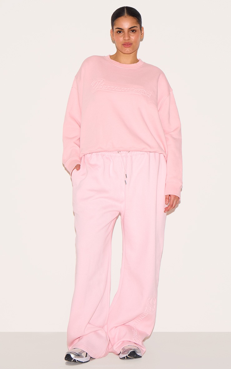 Pretty Little Thing PRETTYLITTLETHING Plus Baby Pink Embossed Graphic Straight Leg Sweatpants